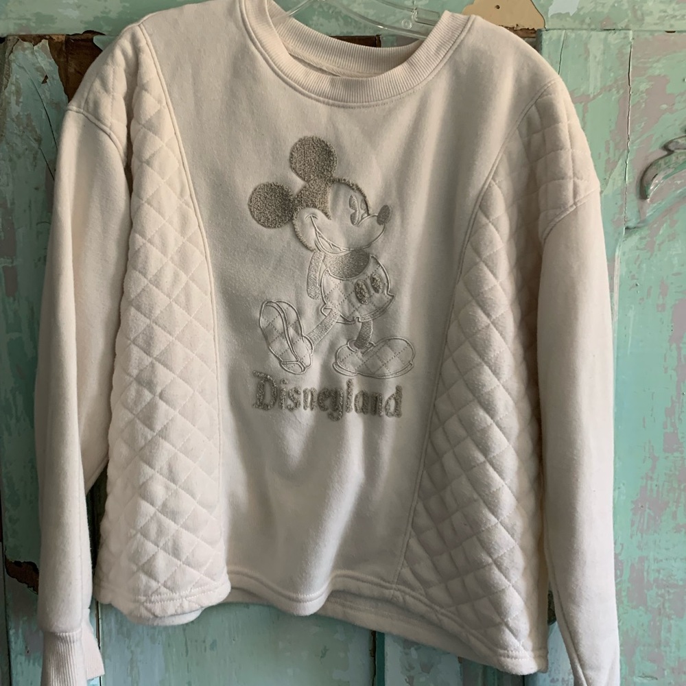 Matching sweatshirt and sweatpants set with Mickey Mouse on it